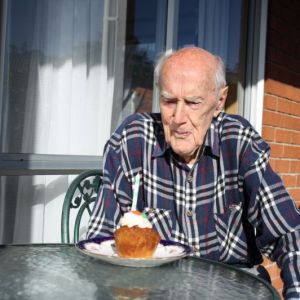 Selwyn_Thompson_enjoys_101st_Cupcake.JPG